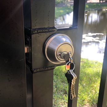 Locksmith repairing a door after a break-in